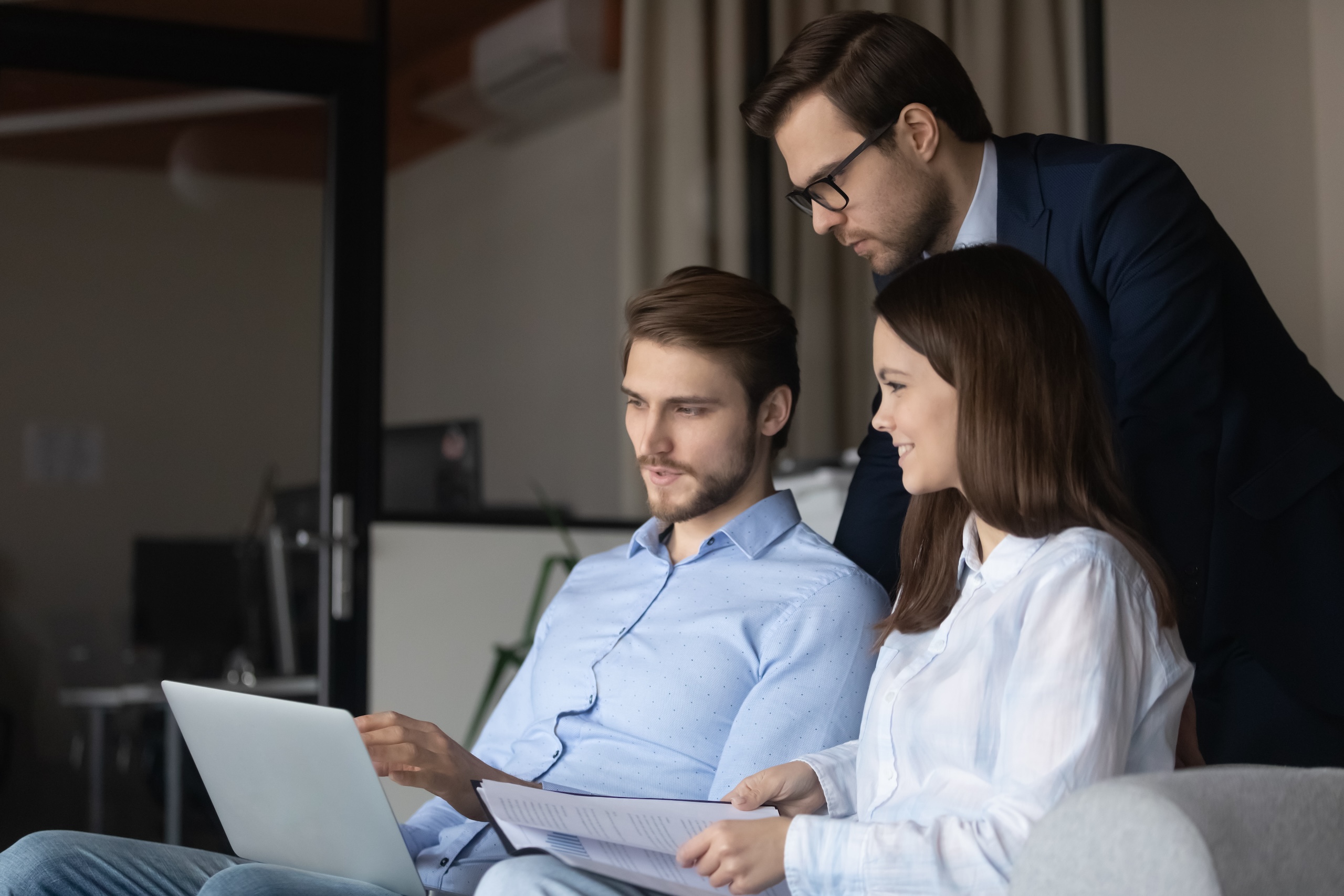 Three students in Basic Sales Training working together